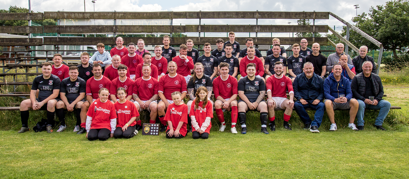 Everyone involved in the football pose at the end of the match