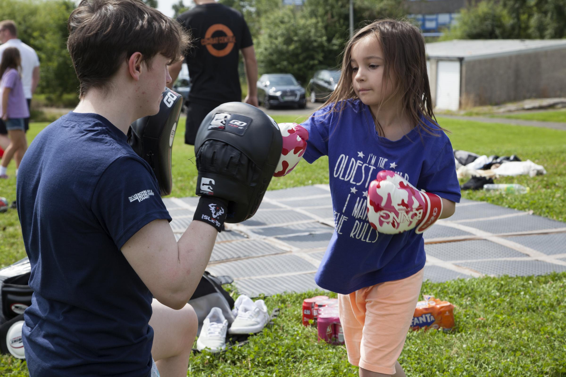 Trainers from Combat Central, a club for boxing and martial arts, invited the children to have a go.