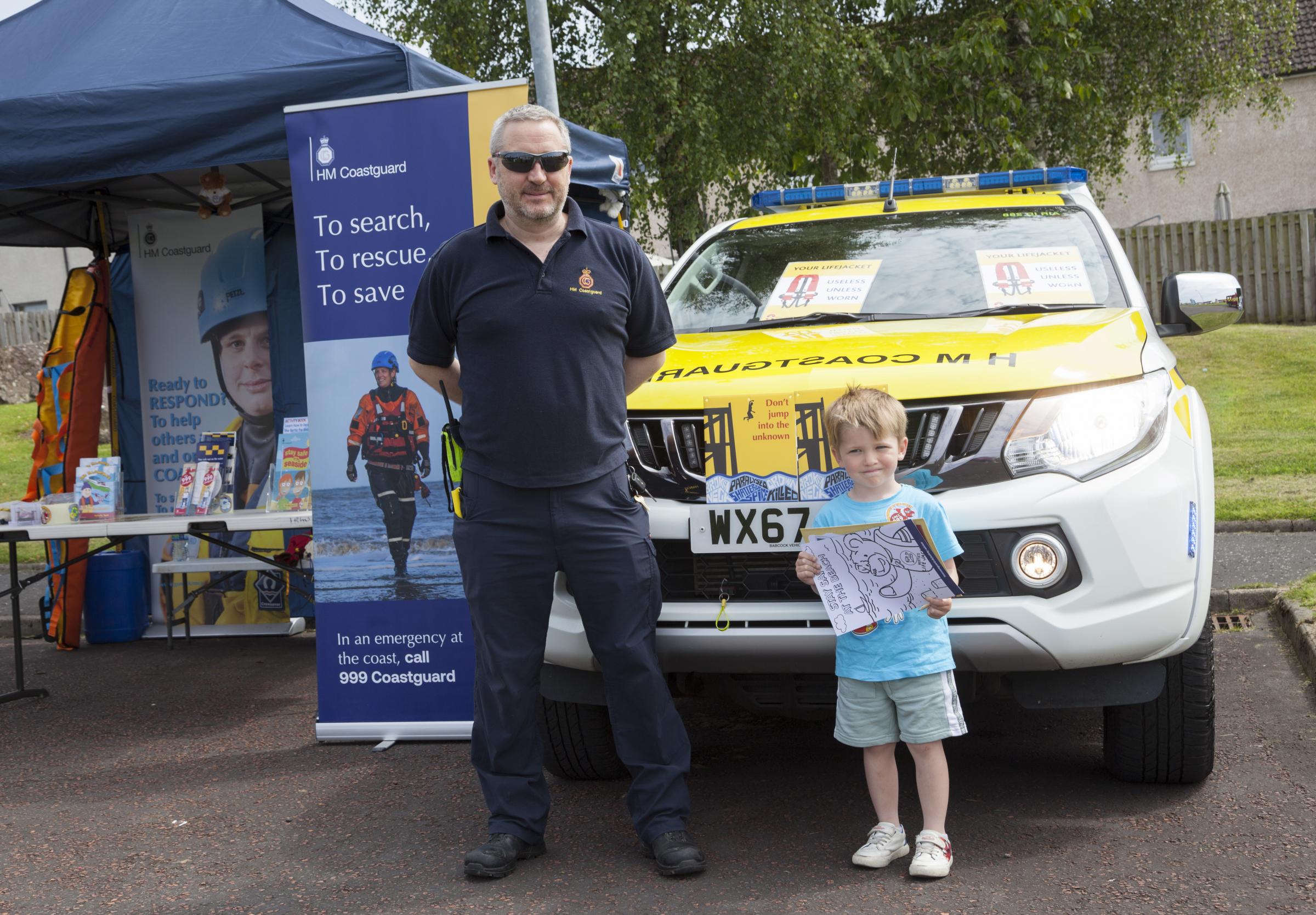 Young Kayden McElroy getting a few tips from HM Coastguard David MacLachlan