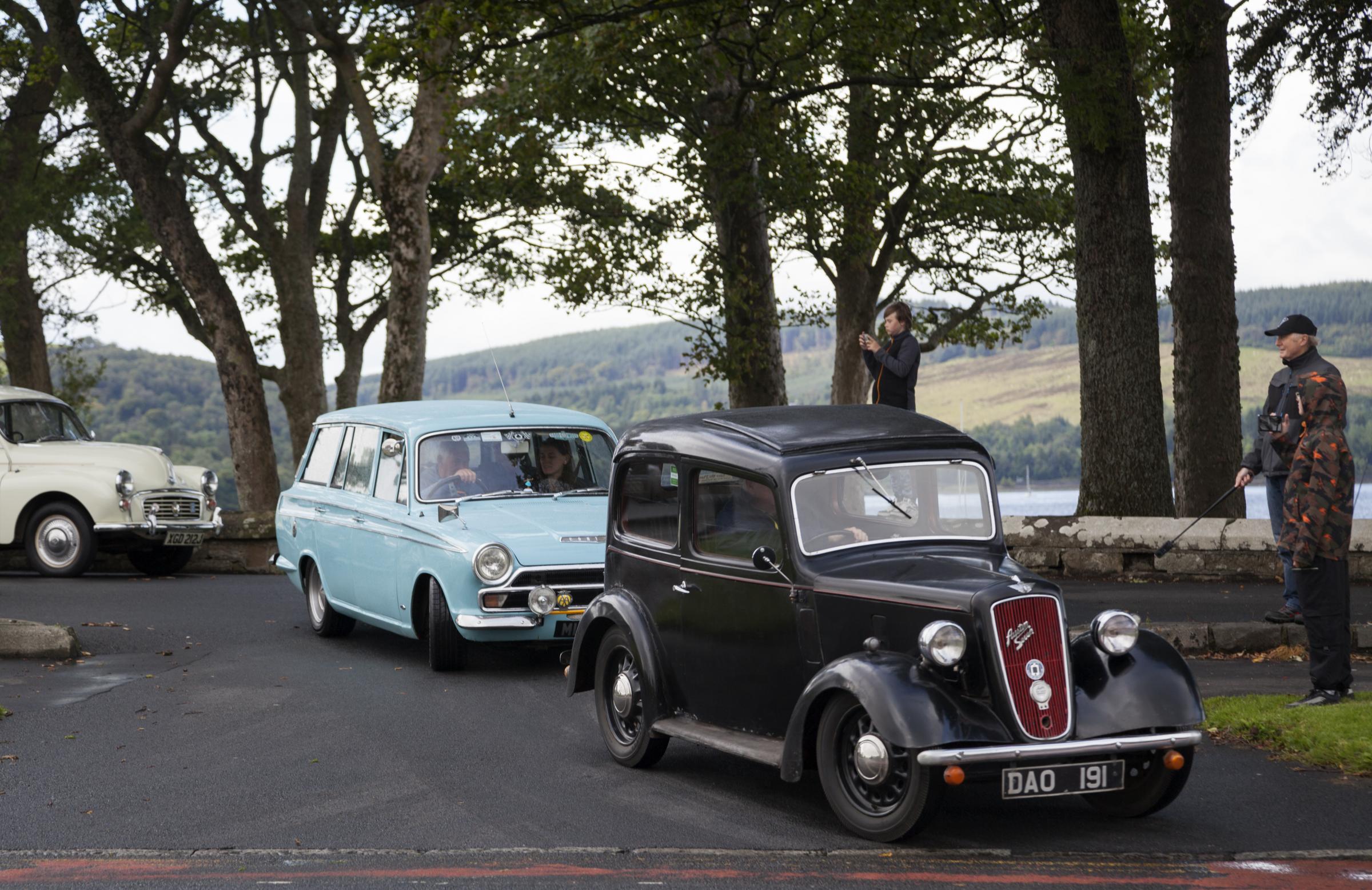 Classic cars at Kidston Park leaving for a run to Rosneath. Austin followed by Ford Cortina followed by a Morris Minor.