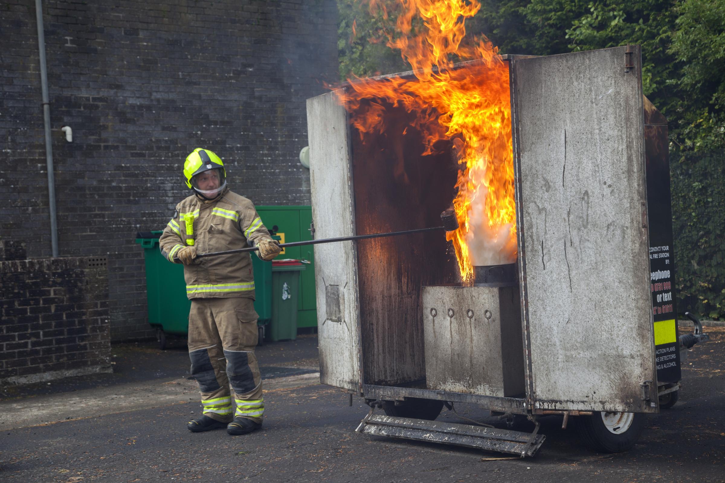 Demonstation of a chip pan fire withing a firebox.