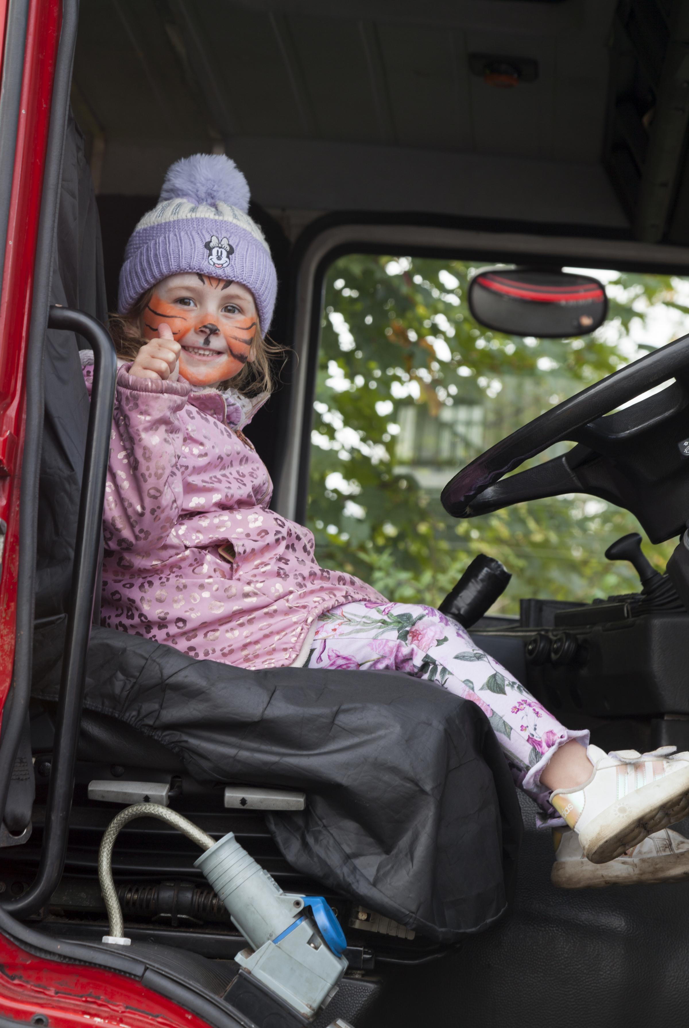 Mila Leitch driving a fire engine.