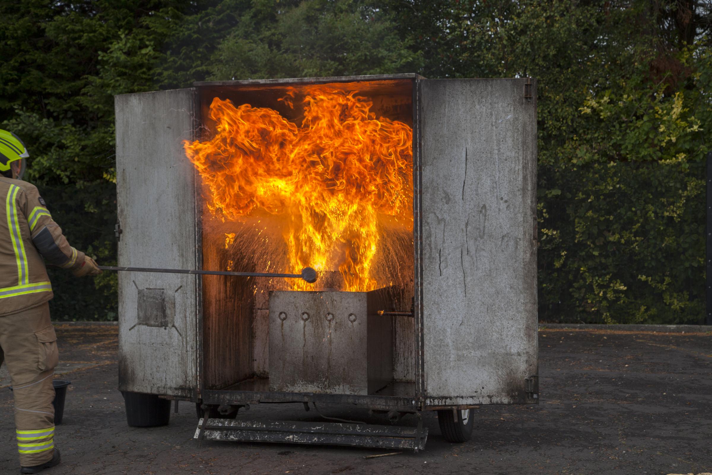 Demonstation simulating a chip pan fire withing a firebox.