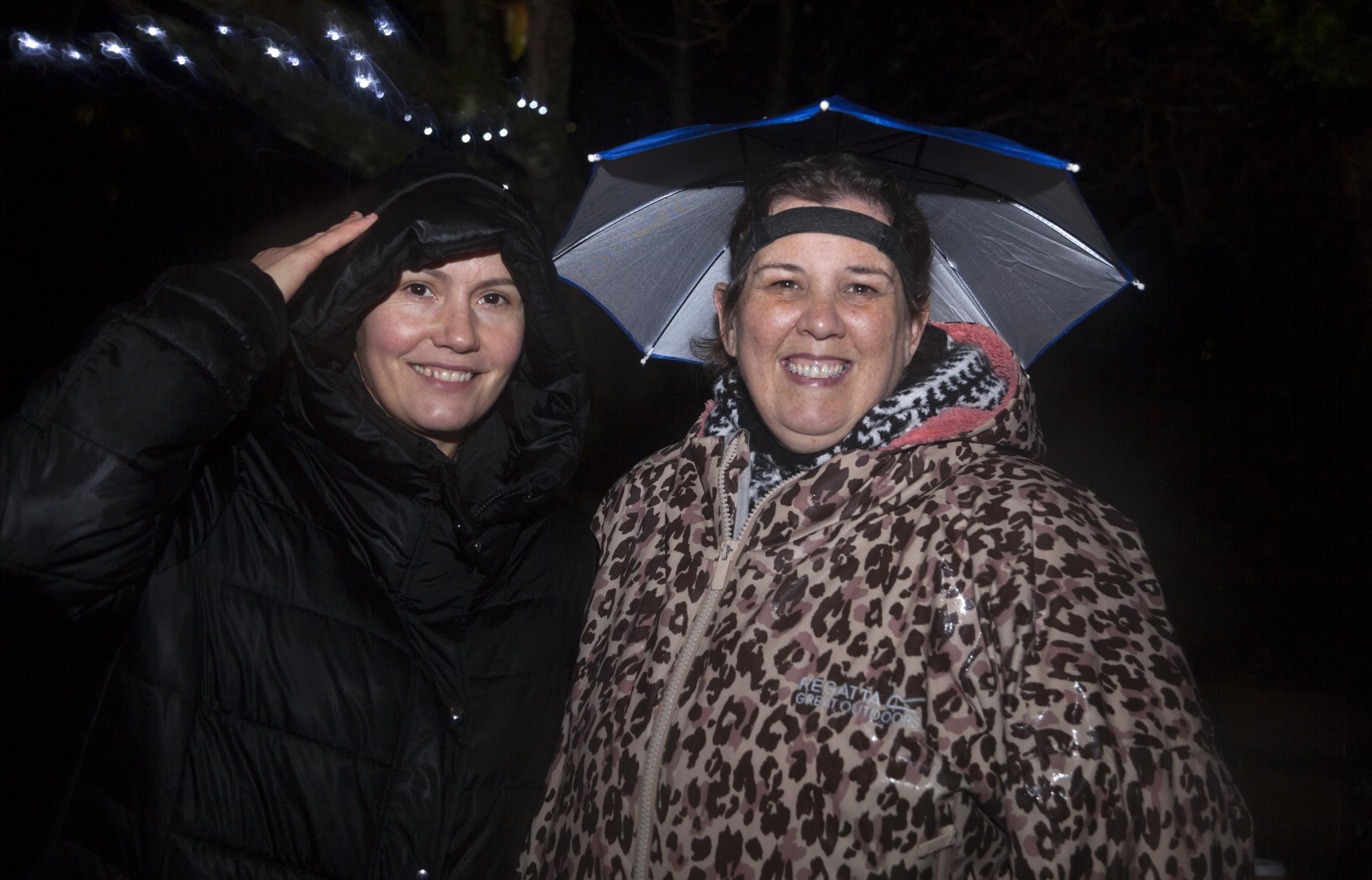 Ladies dressed for the weather at Rhu light switch on